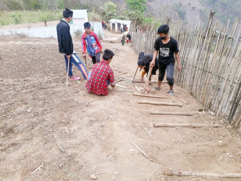 Students of GMS Longya Ward Kiphire constructing a footpath to the school on April 17.